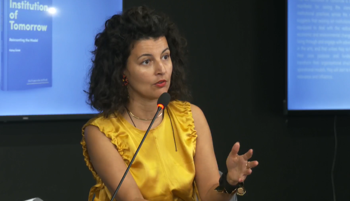 Fatos Üstek, UK based curator and writer presenting her latest book: “The Art Institution of Tomorrow: Reinventing the Model,” at Reporting House on September 6 in Prishtina, Kosovo. Photo: BIRN