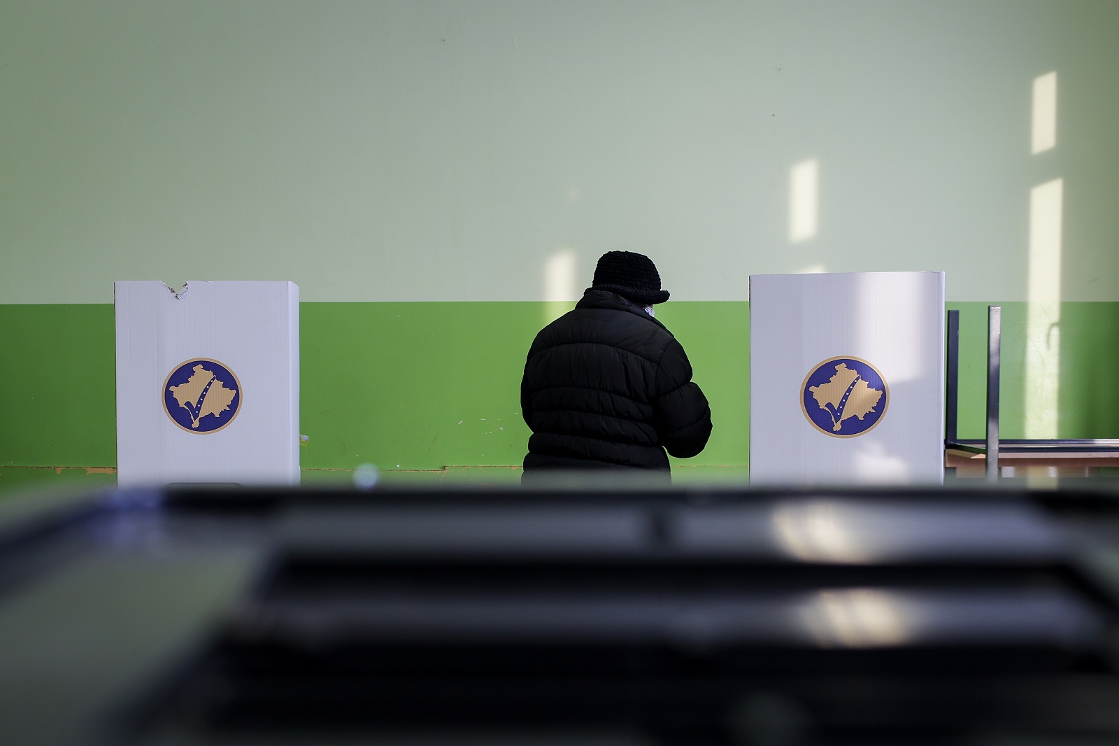 A Kosovo Serb woman prepares to vote at a voting center in Gracanica, Kosovo, 14 February 2021. Kosovo's early parliamentary elections will be held on 14 February 2021. Around 1.8 million voters have the right to cast ballots during snap elections to elect a new 120 seat parliament. EPA-EFE/VALDRIN XHEMAJ